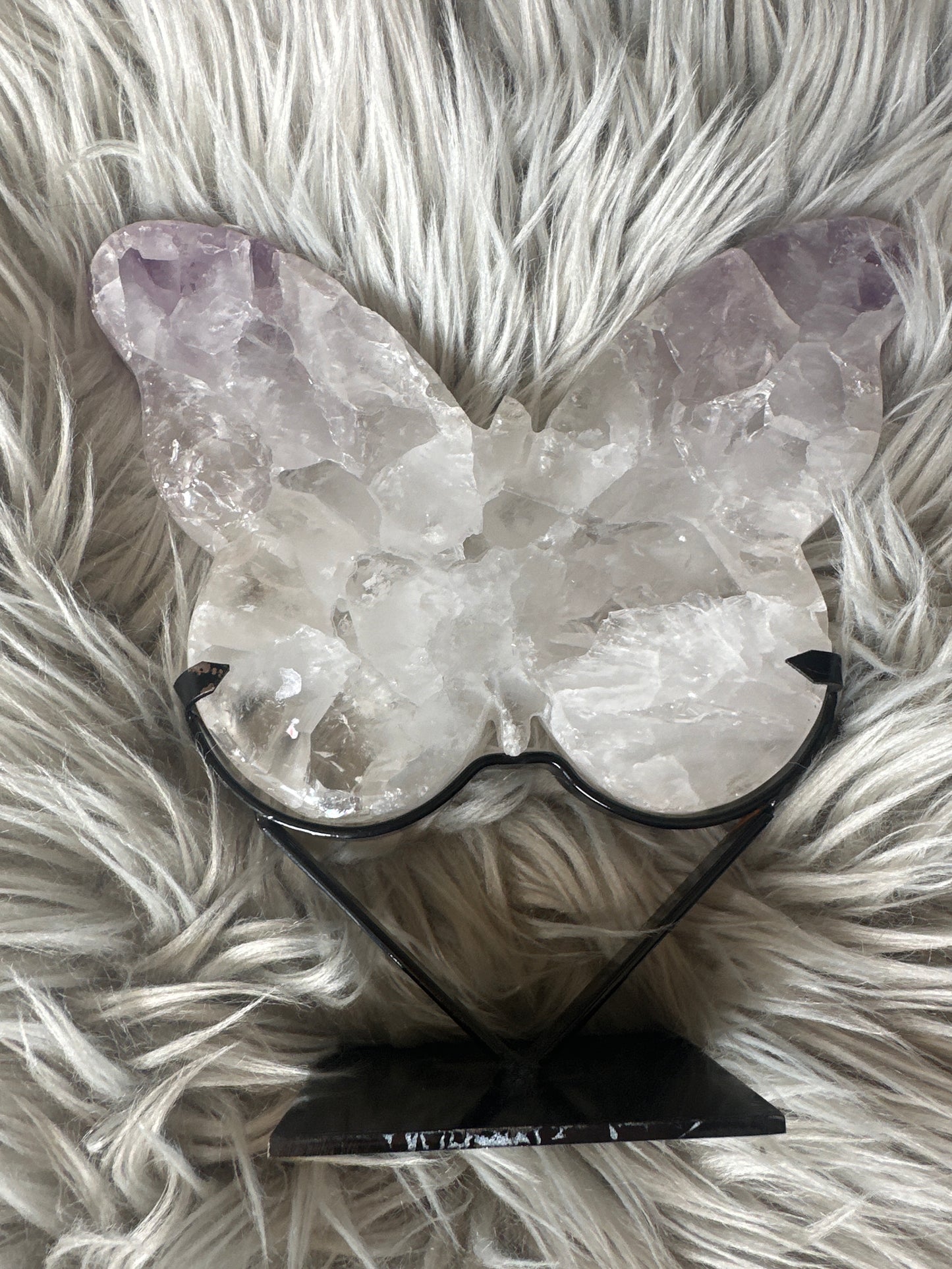 Amethyst and quartz butterfly on stand.