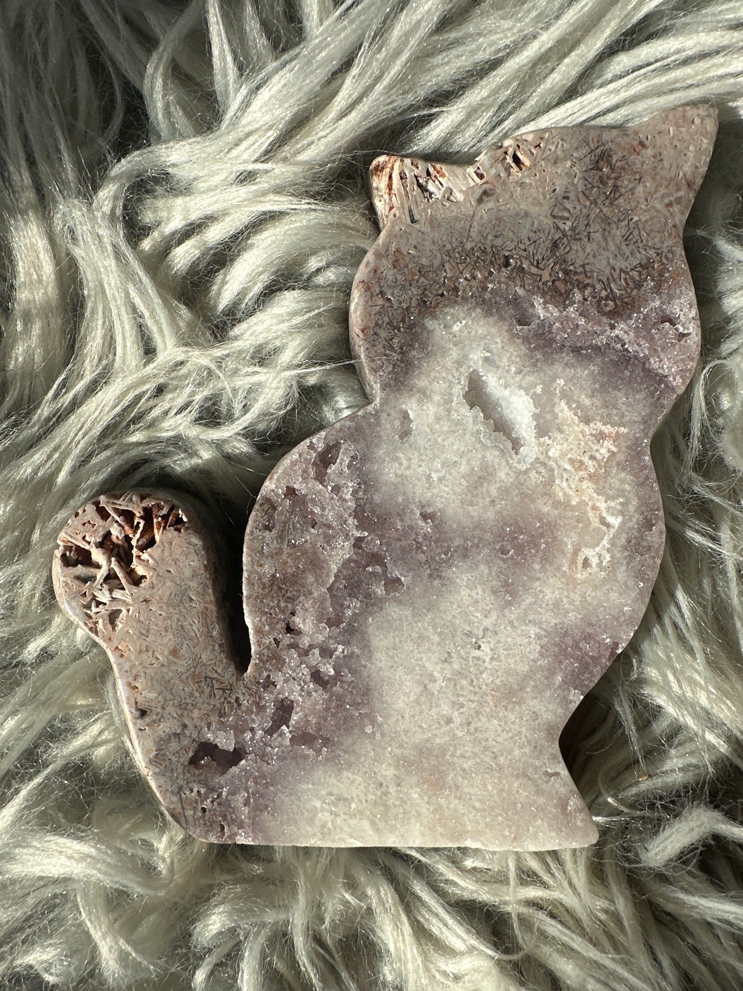 Pink amethyst cat carving with rutile.