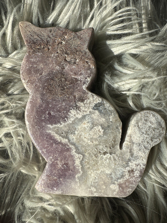 Pink amethyst cat carving with rutile.
