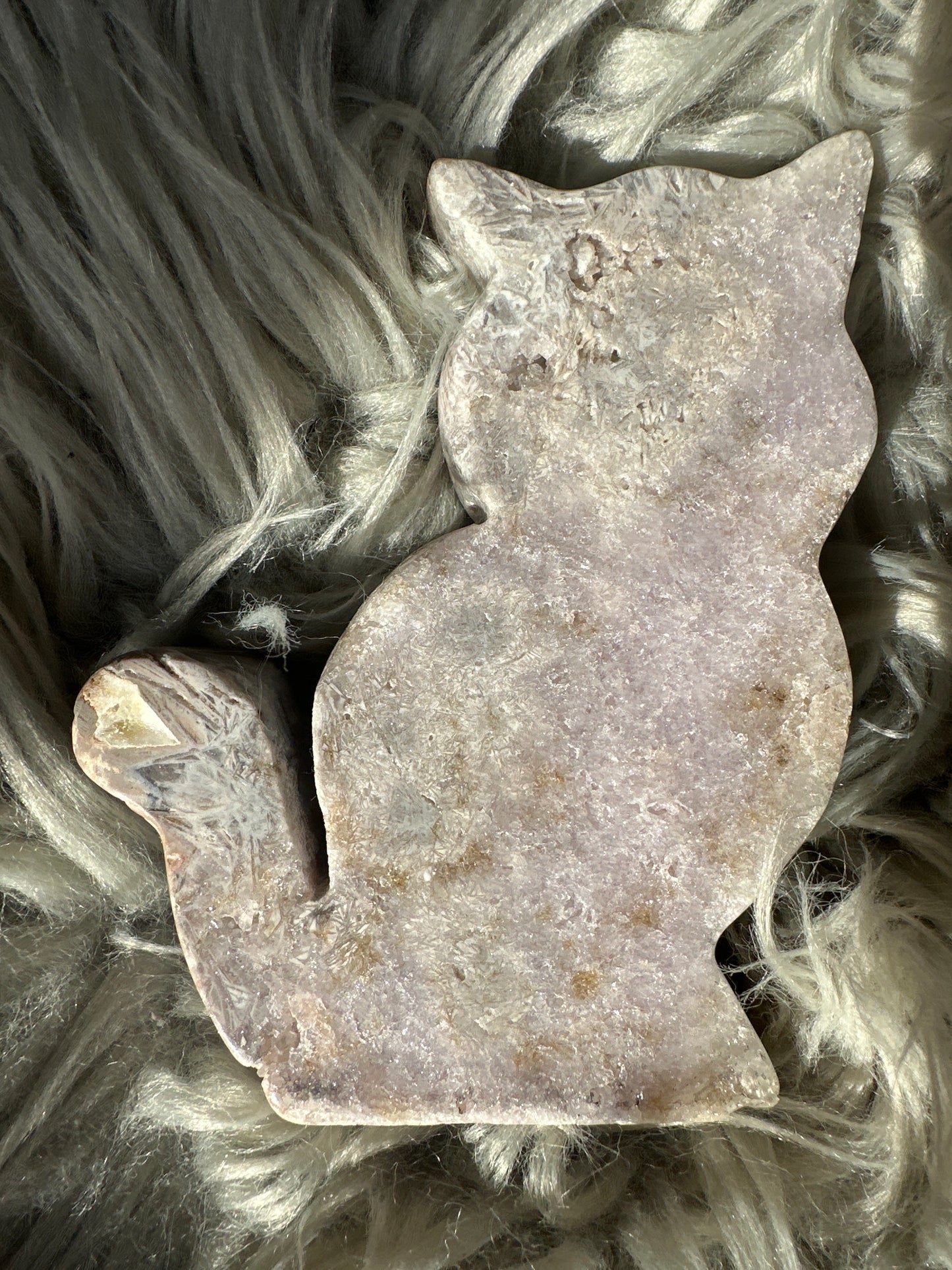Pink amethyst carved cat with rutile.