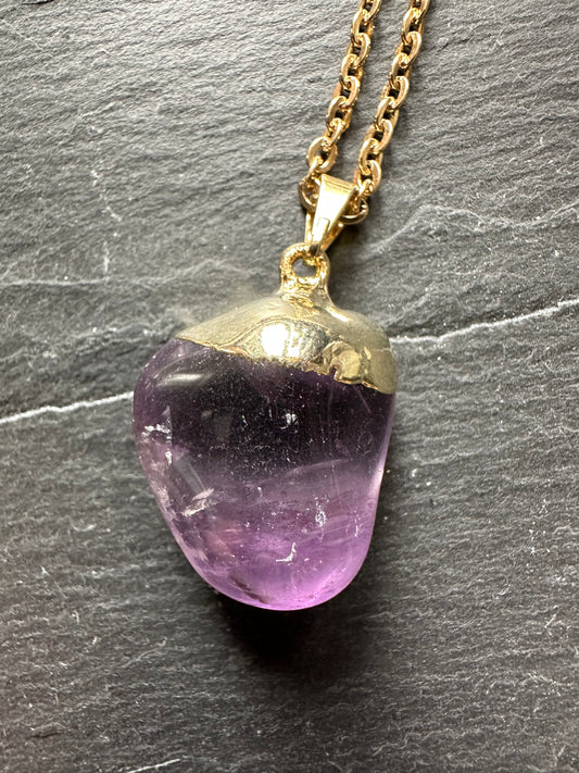 Polished amethyst on chain.