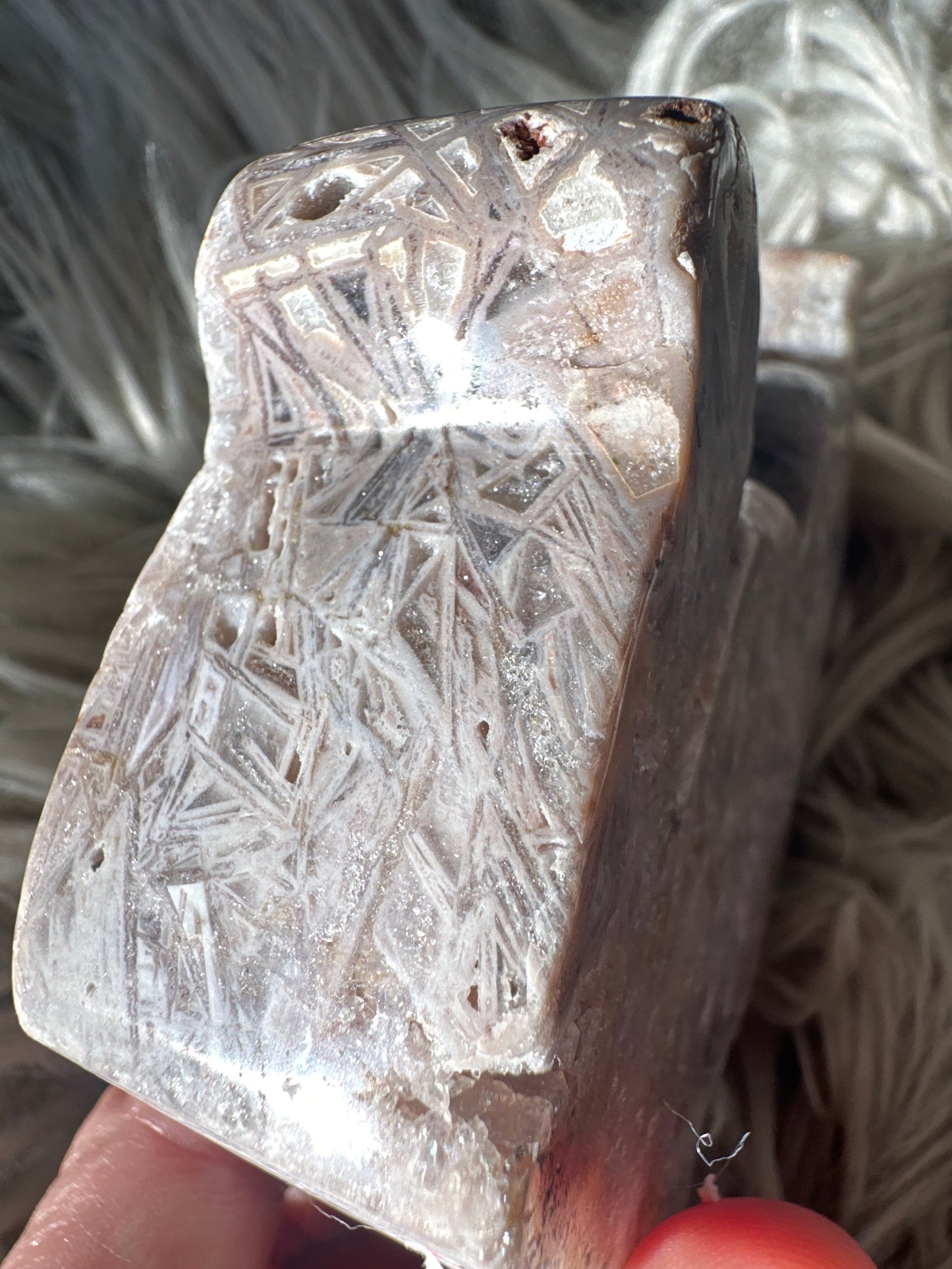 Pink amethyst carved cat with rutile.