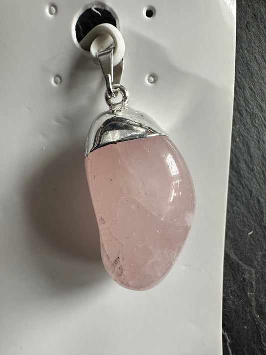 Polished rose quartz pendants