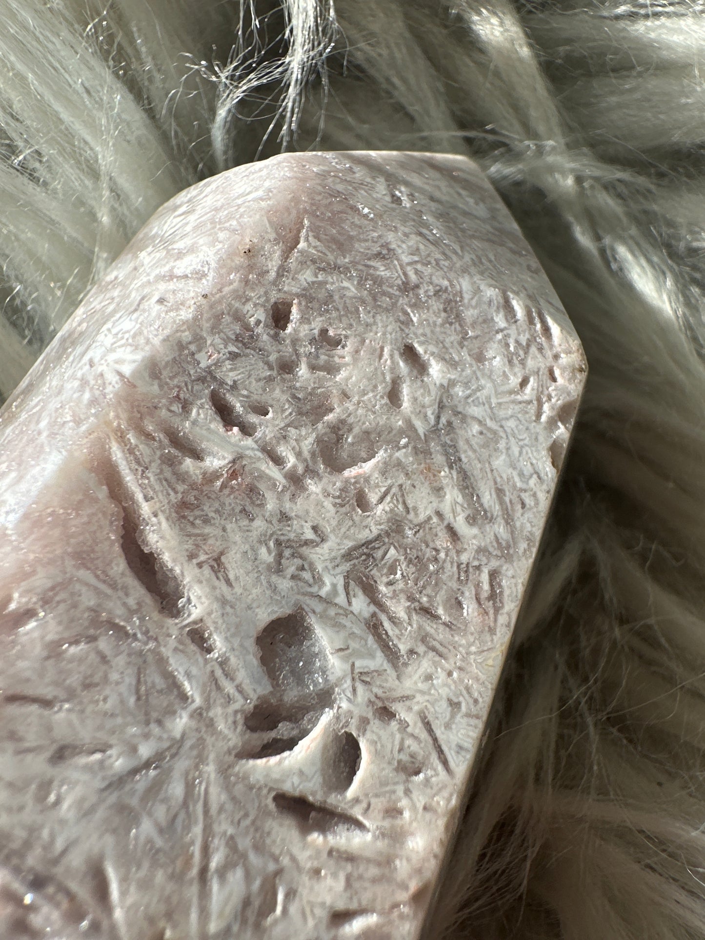 Pink amethyst with rutile tower.