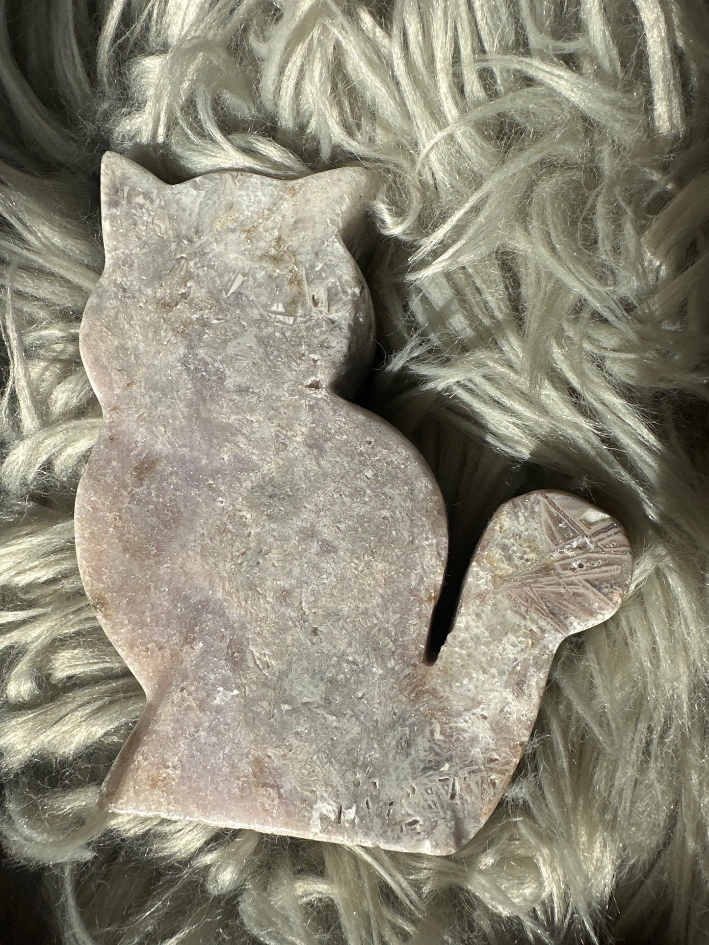 Pink amethyst carved cat with rutile.