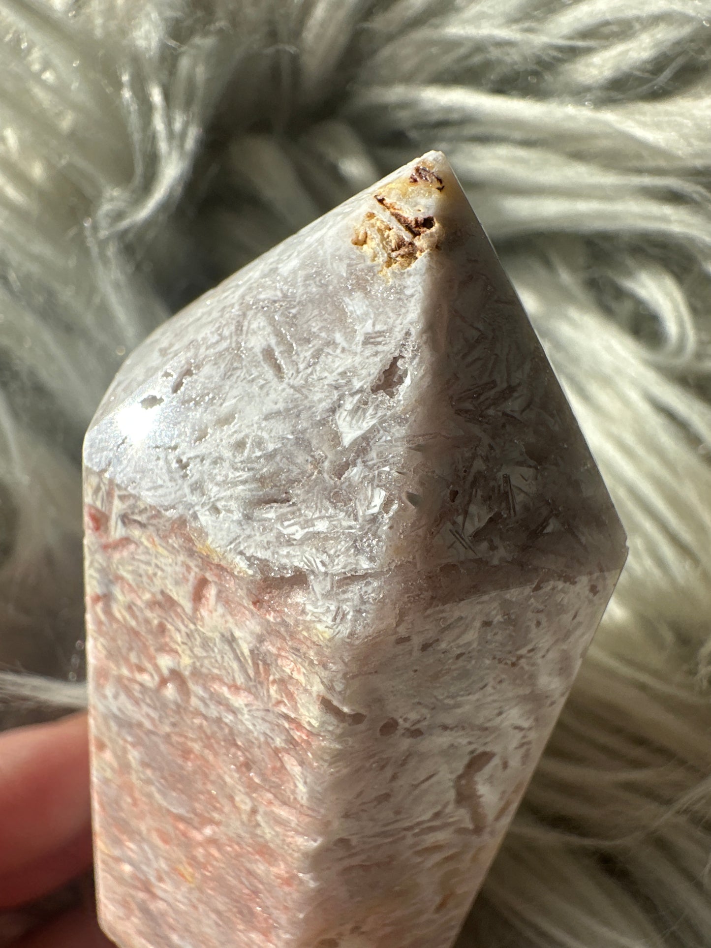Pink amethyst with rutile tower.
