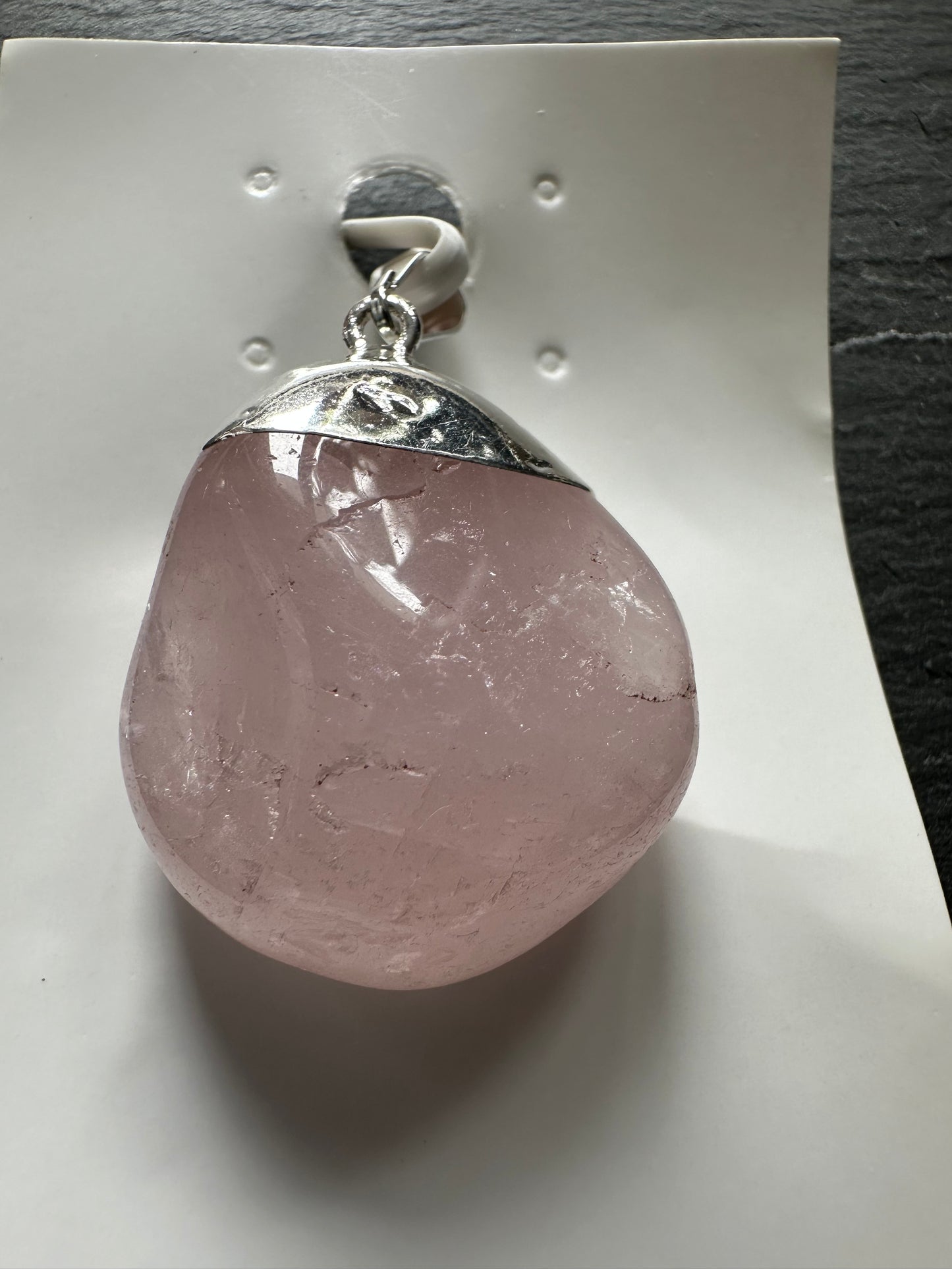 Polished rose quartz pendants