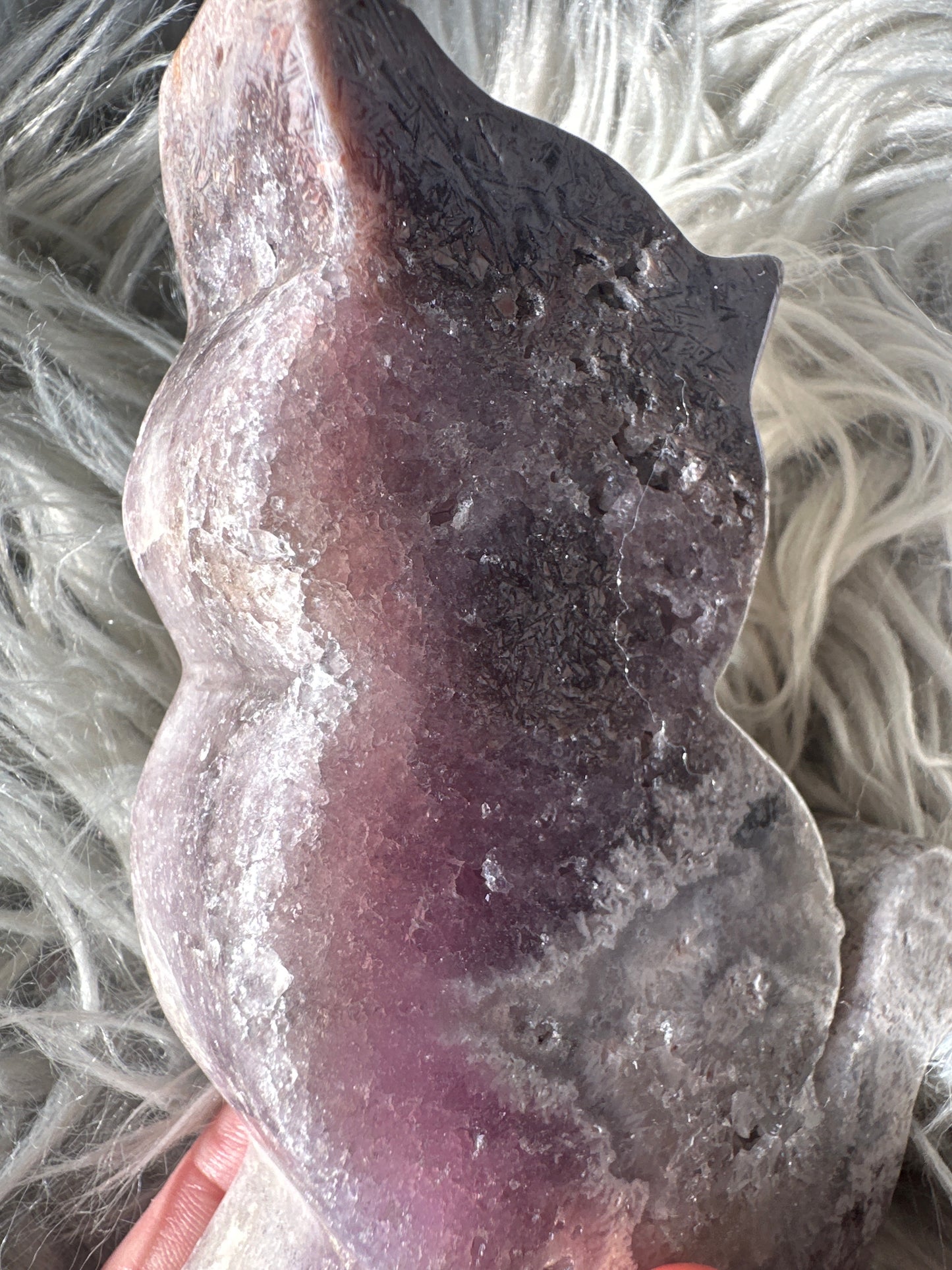 Pink amethyst cat carving with rutile.