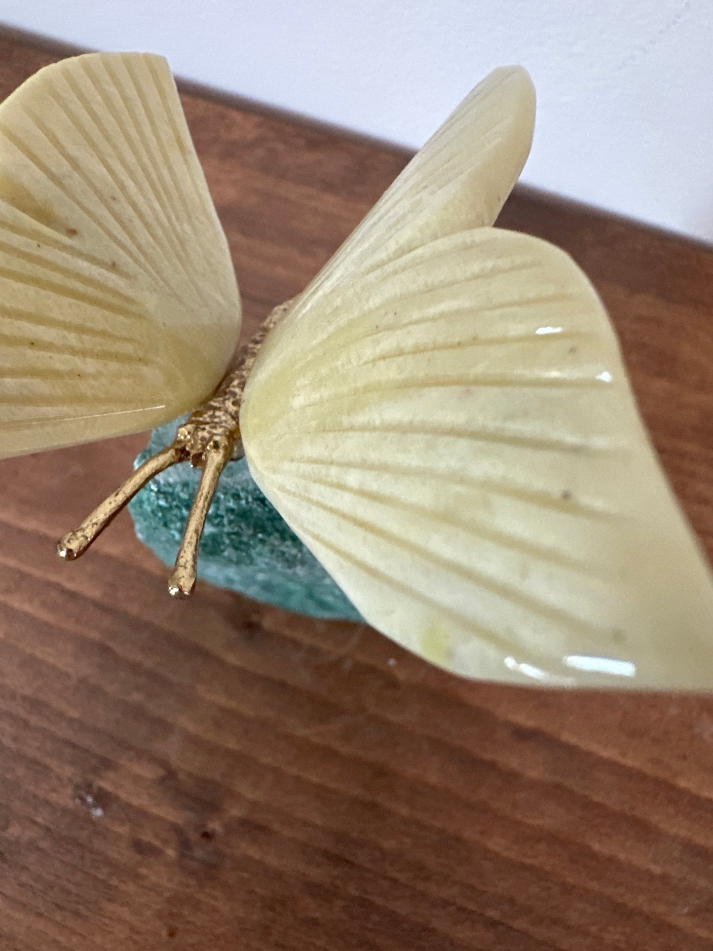 Yellow butterfly on fushsite